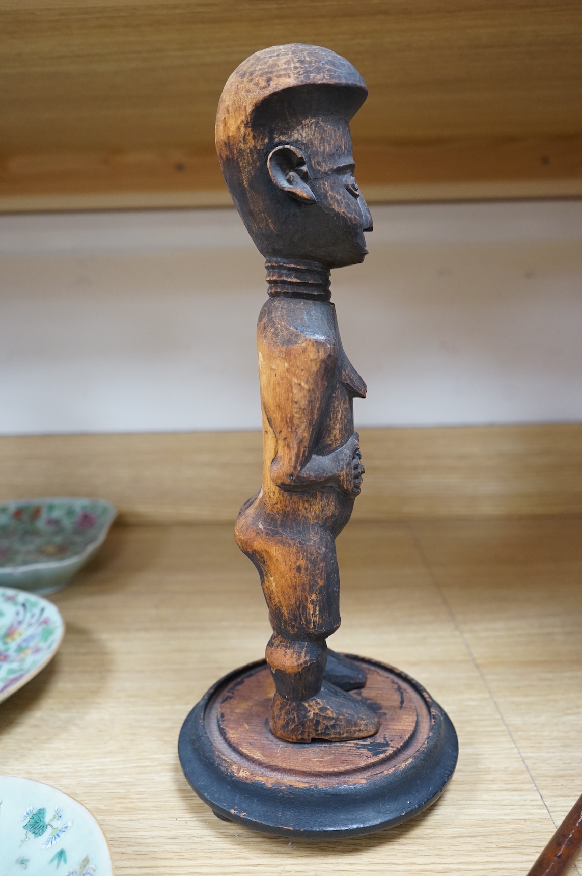 A Fang peoples female reliquary figure, Equatorial Guinea, Provenance - vendors grandfather in law brought back from Africa when working in the Gold Coast late 19th/early 20th century, on stand, 36cm high not including s